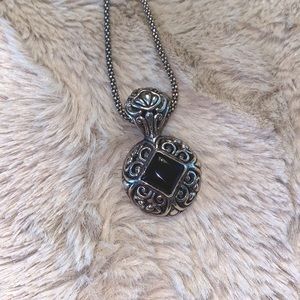 925 sterling silver pendant with 18” chain. Onyx and antique filigree design